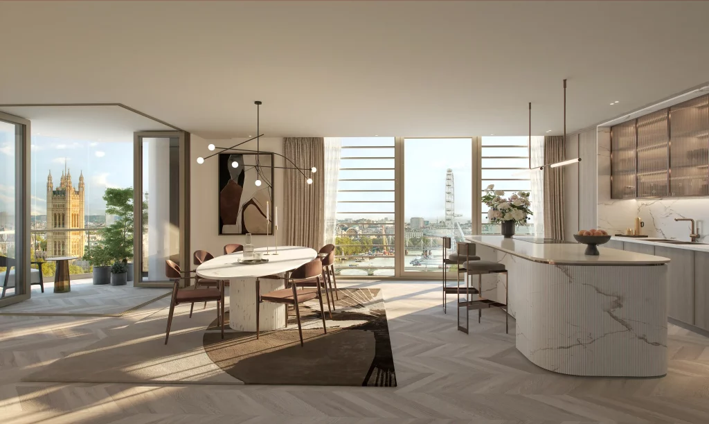 A bright interior shot showcasing an open-plan dining and kitchen area. The space features modern design elements, with views of London landmarks visible through the windows.