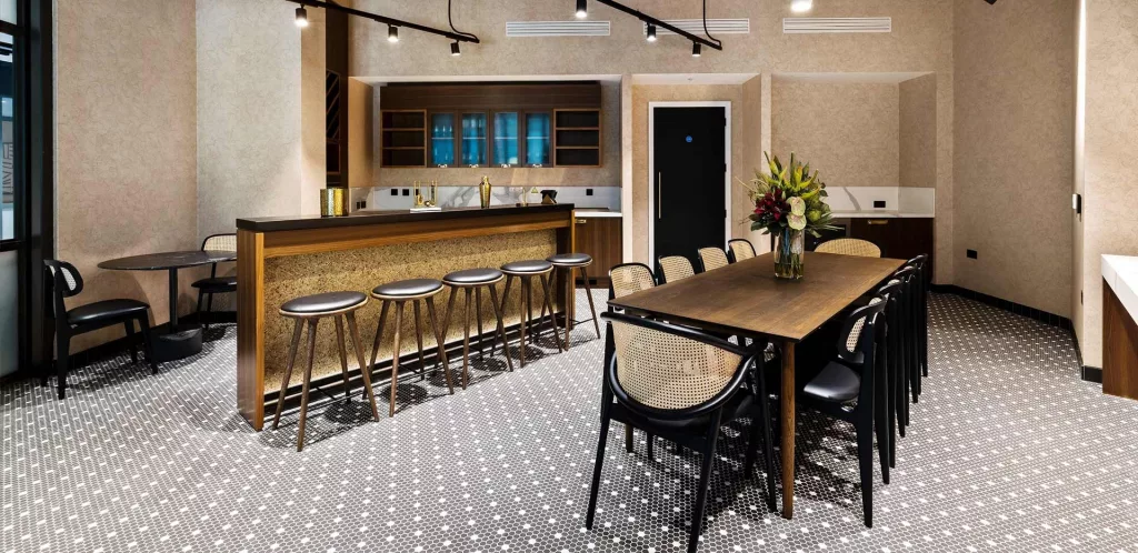 Property modern dining and kitchen area with sleek furniture elegant lighting and stylish decor perfect for gatherings and socializing in a contemporary environment property